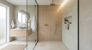 A bright, modern bathroom featuring a sleek, minimalist walk-in shower with a glass panel, finished